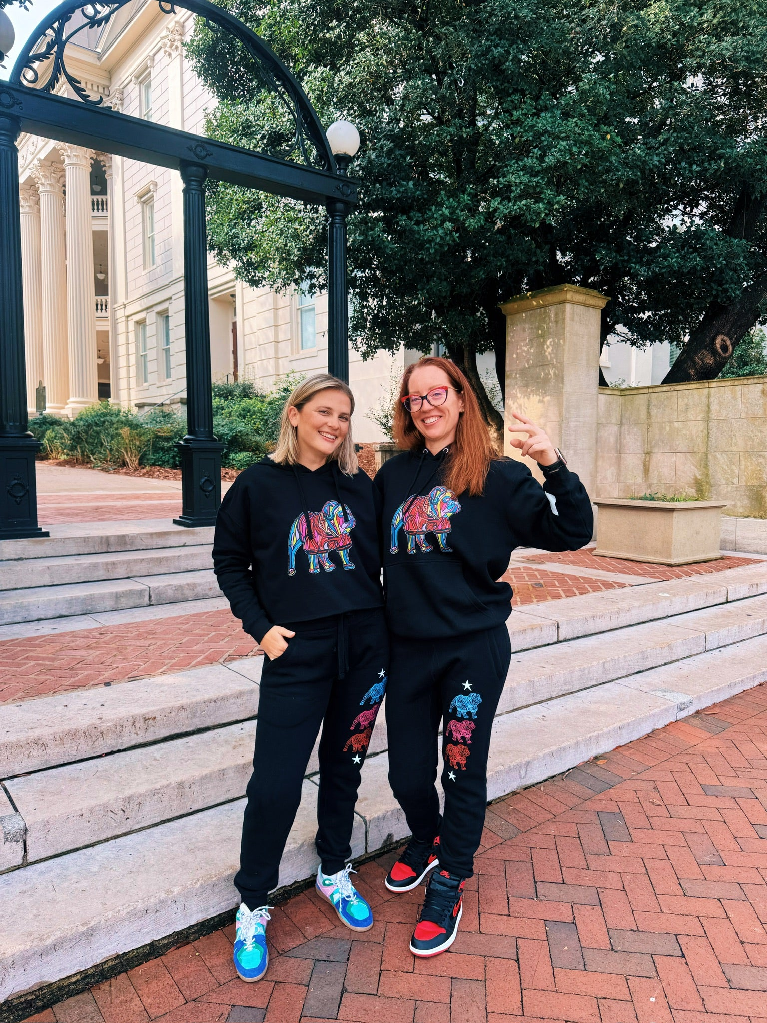 Dr. Betsy Grunch and Chandler Sherry wearing Game Day Collection merch at UGA