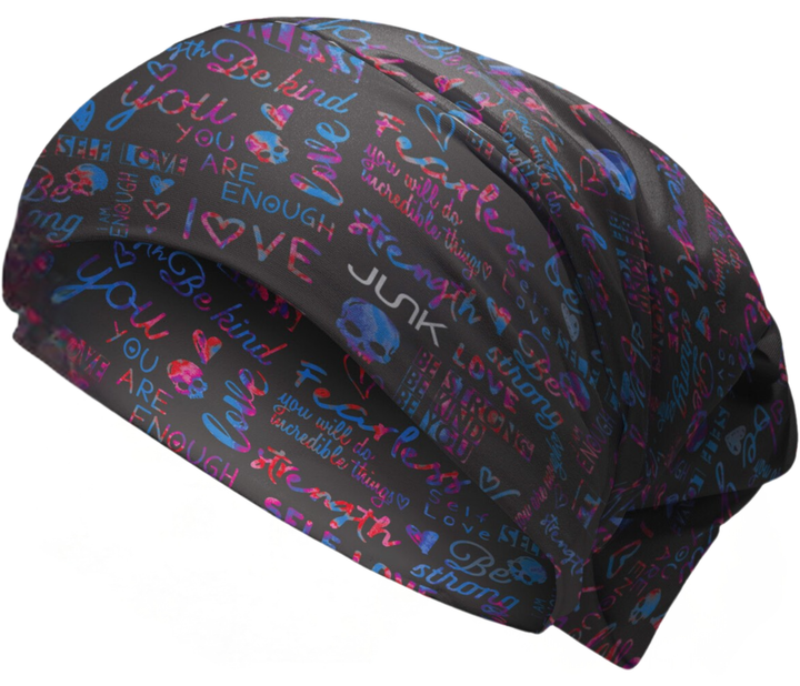 Colorful scrub cap with motivational phrases on a black background