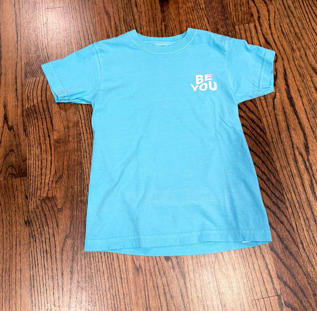 Flat lay of front of Be You Youth Tee – Kids Lagoon Blue T-Shirt 