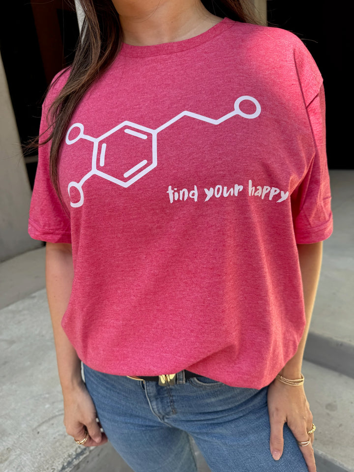 Person wearing a red t-shirt with a dopamine chemical structure design and text 'find your happy'.