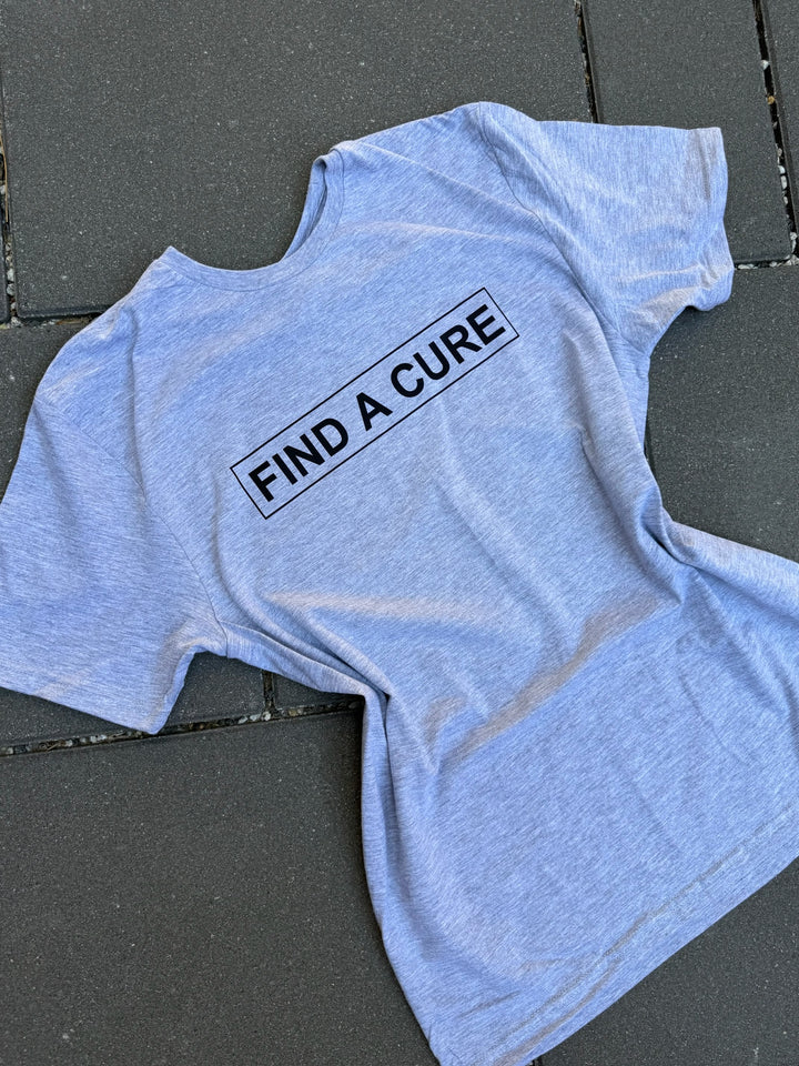 Gray t-shirt with 'FIND A CURE' text on a dark surface