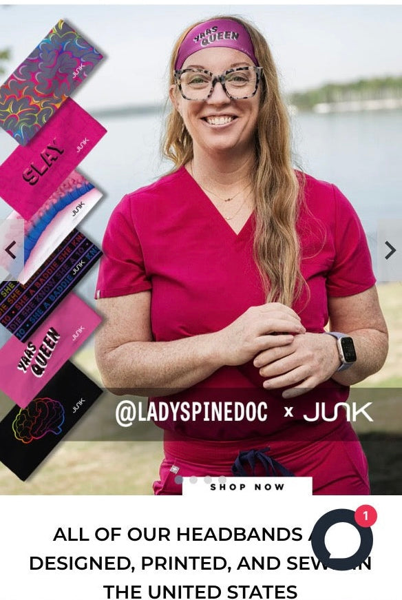 Ladyspinedoc wearing a red Ladyspinedoc x Junk athletic headband, with a selection of other headbands displayed in the background.