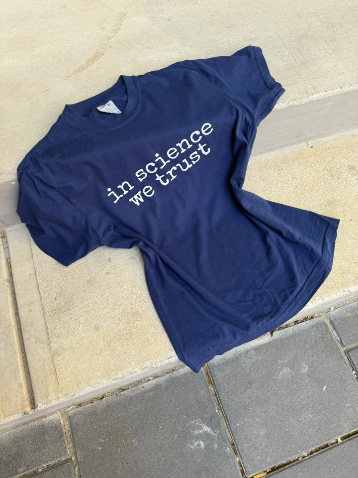 navy shirt with the phrase in science we trust (in white) on it