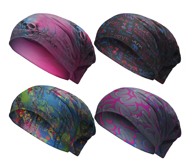 Four colorful scrub caps with abstract patterns on a white background