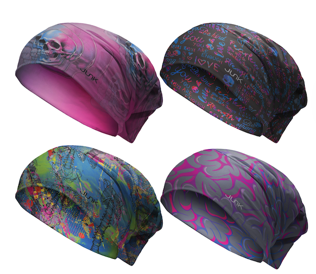 Four colorful scrub caps with abstract patterns on a white background